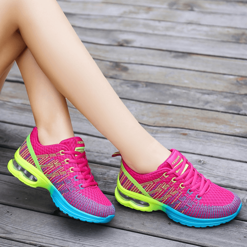 Bright mesh women's breathable sneakers with neon accents and lightweight EVA outsole, perfect for active sports or casual wear.